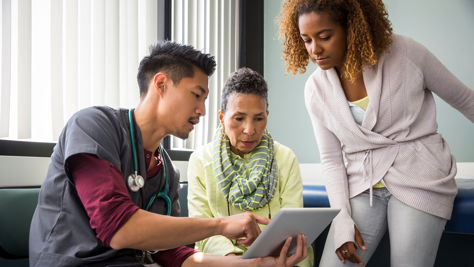 Doctor reviewing paperwork with patients