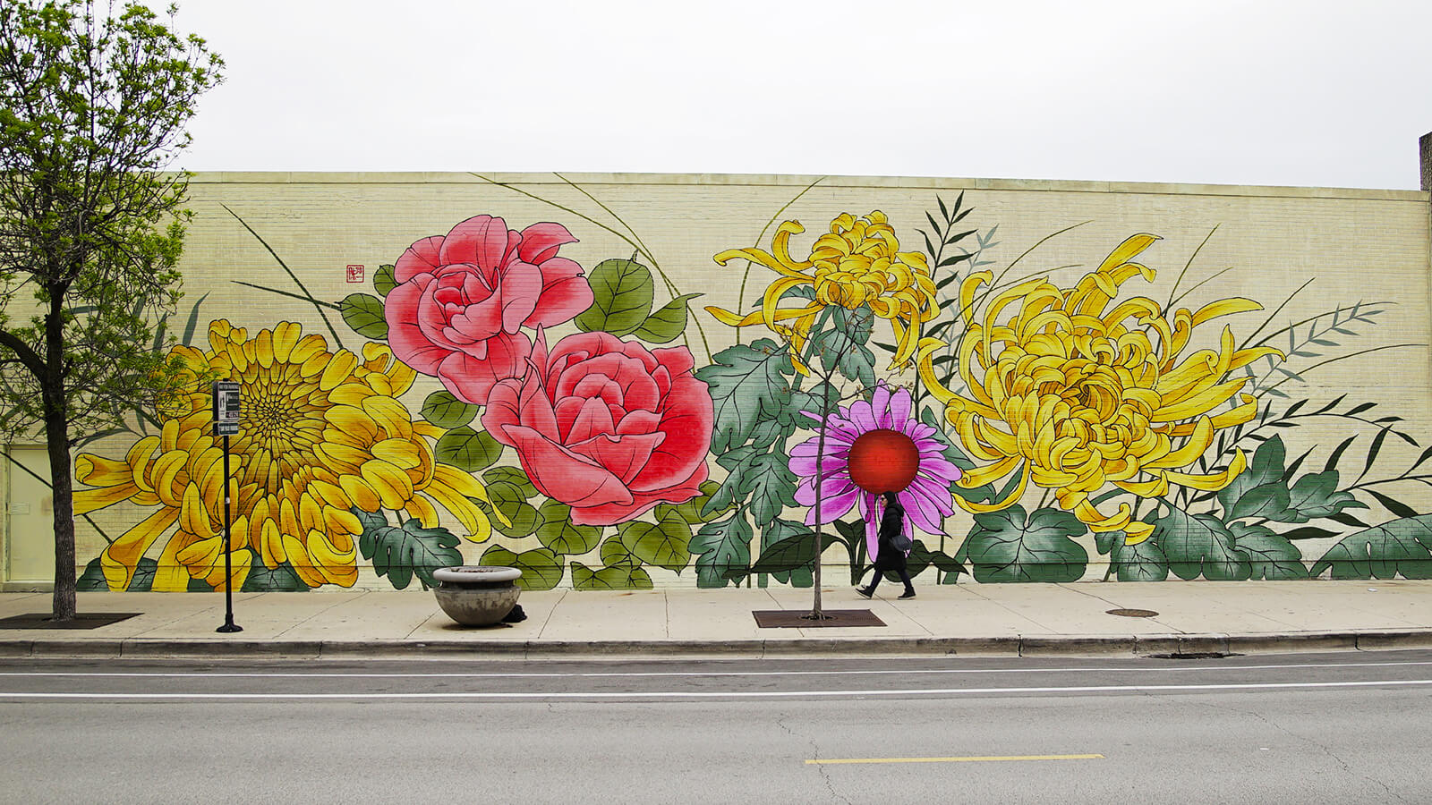 A flower mural on the side of a CVS Pharmacy.